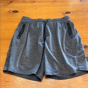 Russell Athletic Men's Athletic Dri Power shorts with zipper pockets.